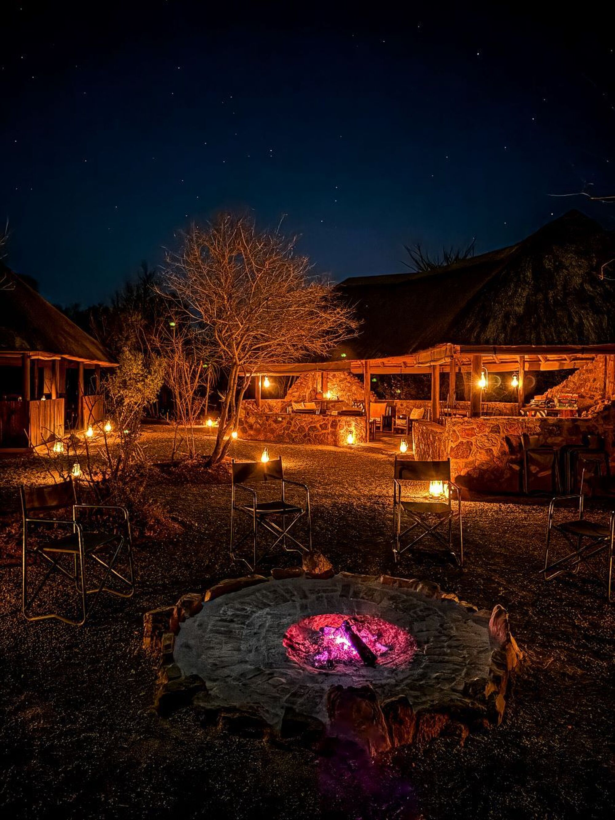 Cosy fireside evening at safari camp in winter Adam Joyce